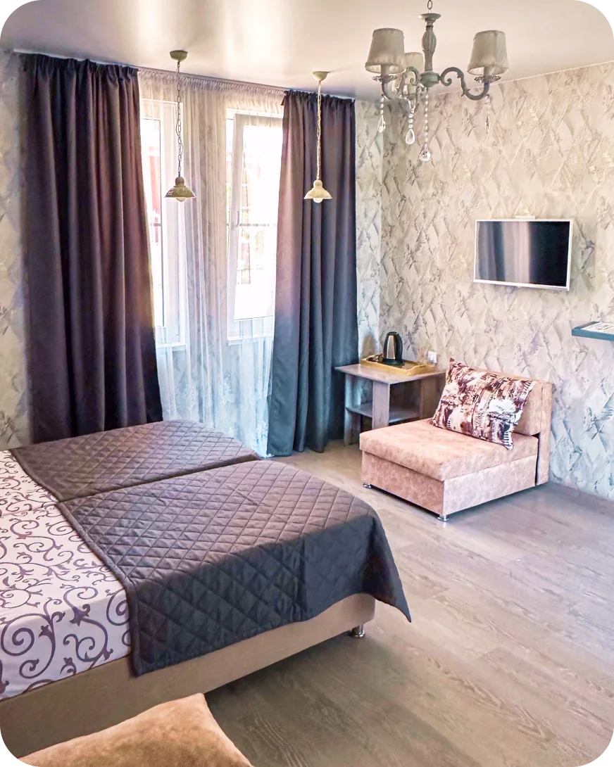 Номер Люкс - просторный номер с двуспальной кроватью и диваном